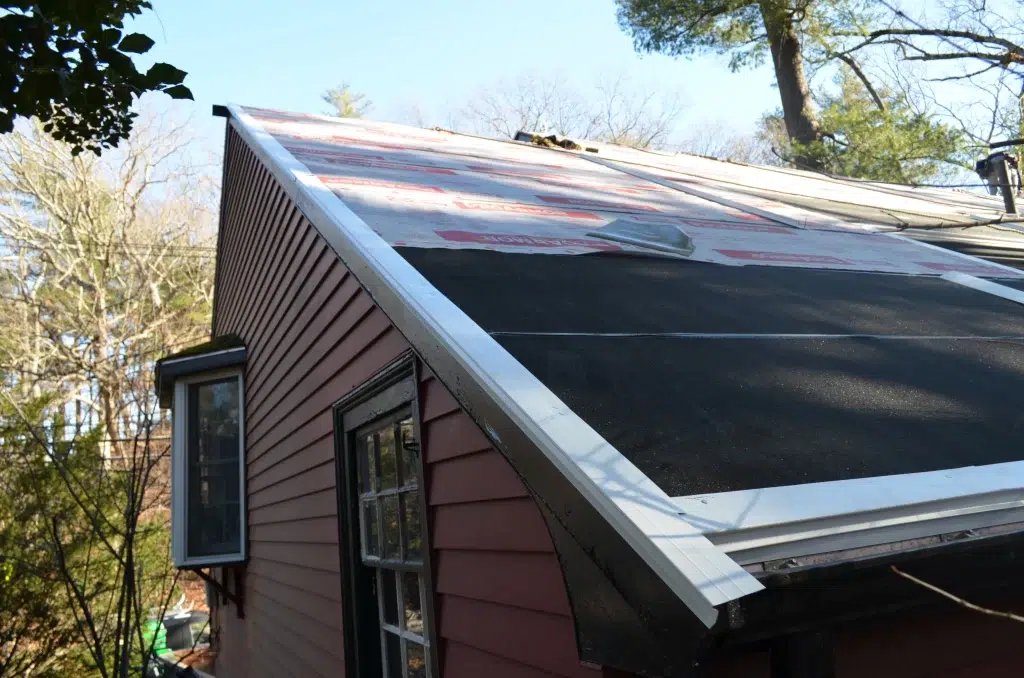 Home in Norwood, MA, getting roof repairs courtesy of O'LYN Roofing